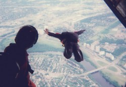 paratrooper jumping from airplane